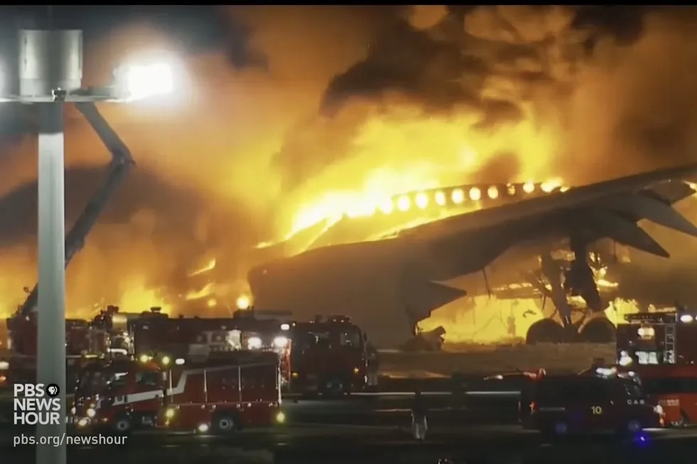 Japan Airlines runway fire 1 January 2024, PBS NewsHour screen grab