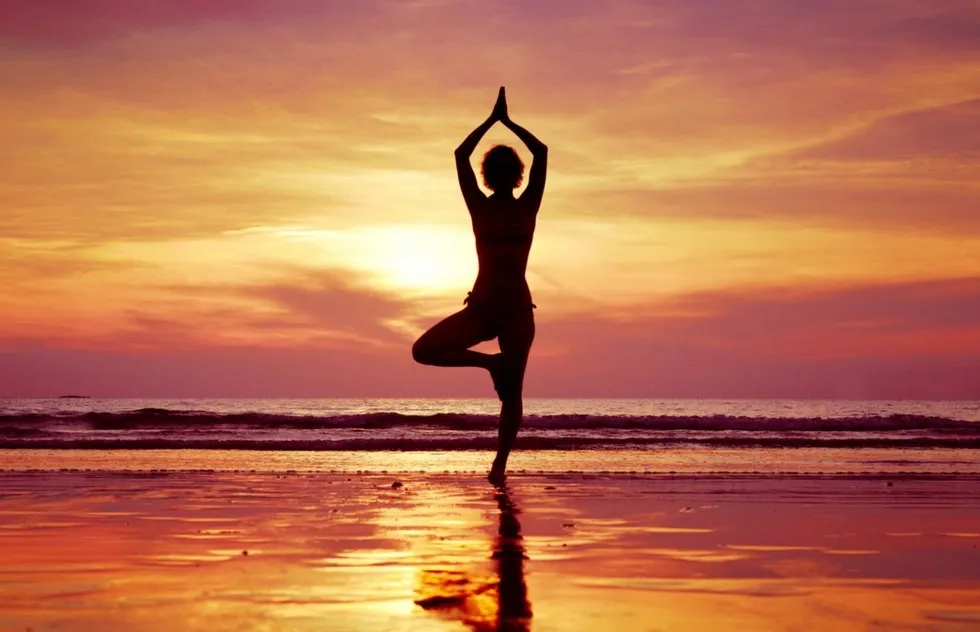 Yoga during beach sunset