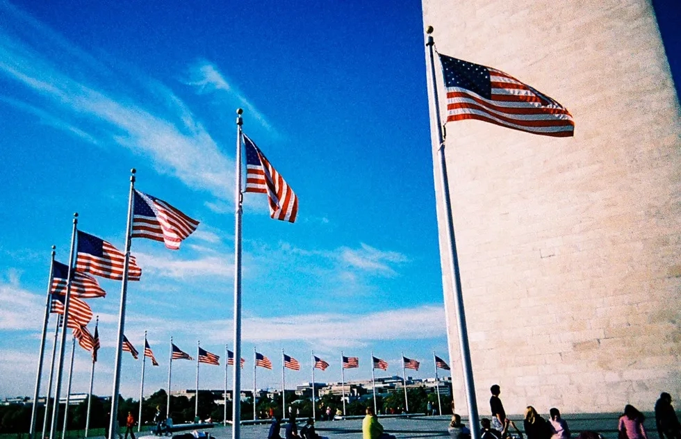 A ring of American flags surrounds the Washington Memorial in Washington, DC