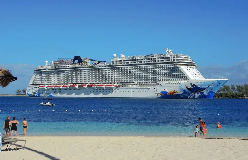 Norwegian Escape ship at port by Bahamas beach