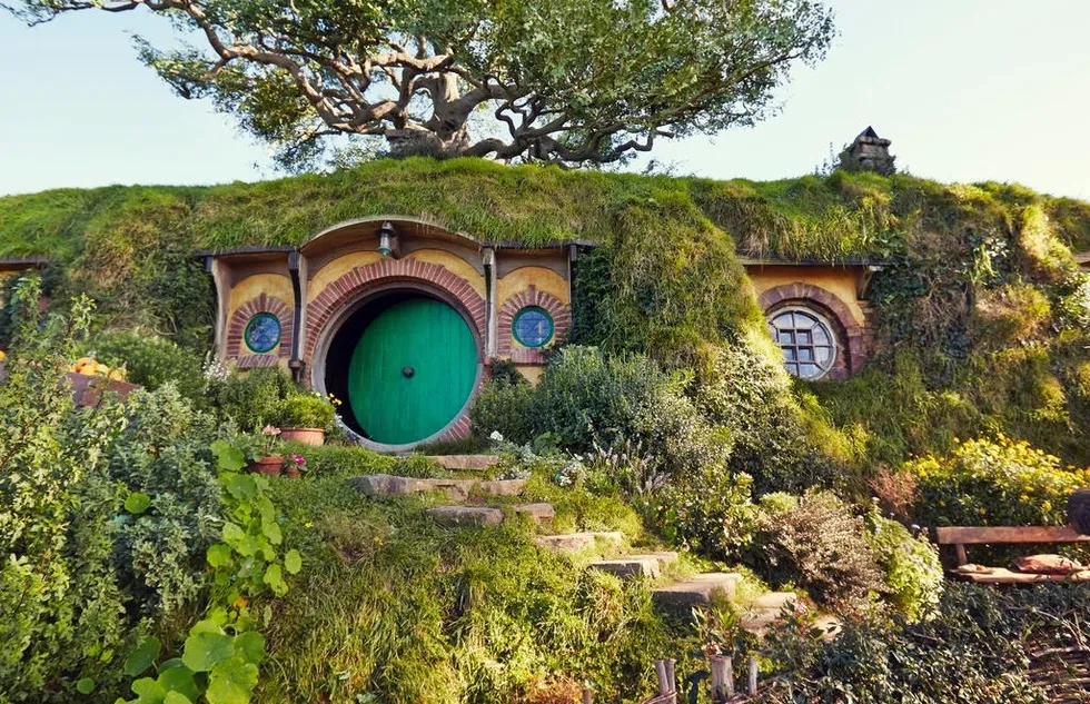 A "Hobbit hole" built into a hillside at the Hobbiton Movie Set in New Zealand