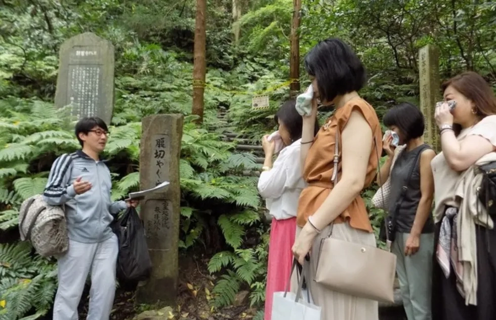 Hidefumi Yoshida leads a therapeutic crying tour in Kamakura, Japan