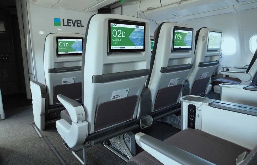 LEVEL airlines cabin with seat-back screens