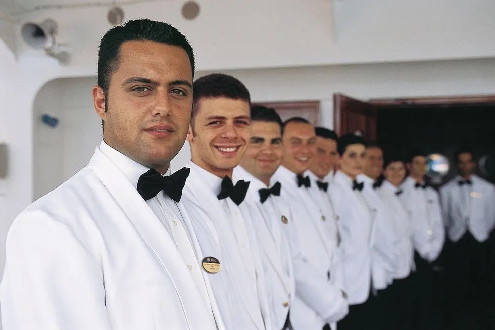 Cruise crew members in a line, MSC Cruises