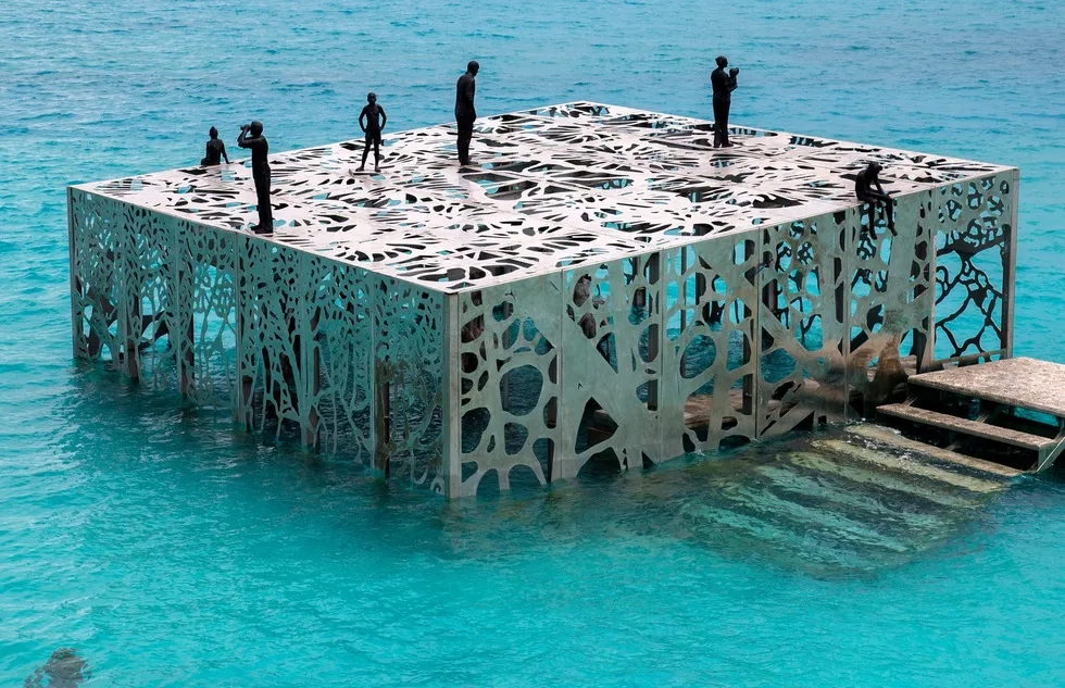Jason deCaires Taylor's "Coralarium," a semisubmerged sculpture gallery at the Fairmont Maldives Sirru Fen Fushi