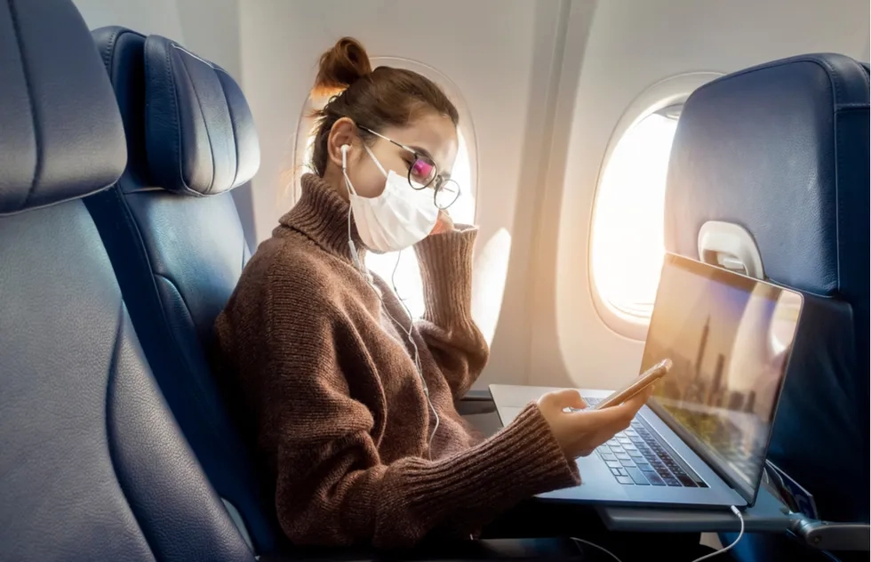 Masked airplane passenger