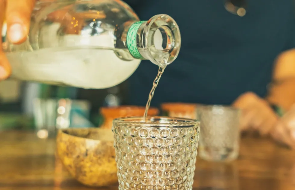 Pouring mezcal in Oaxaca, Mexico