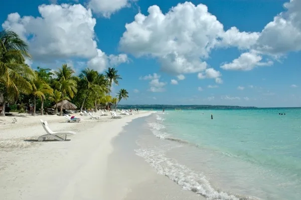 Lounge chairs on the beach in front of Margarita's on Negril's Seven Mile Beach in Jamaica.