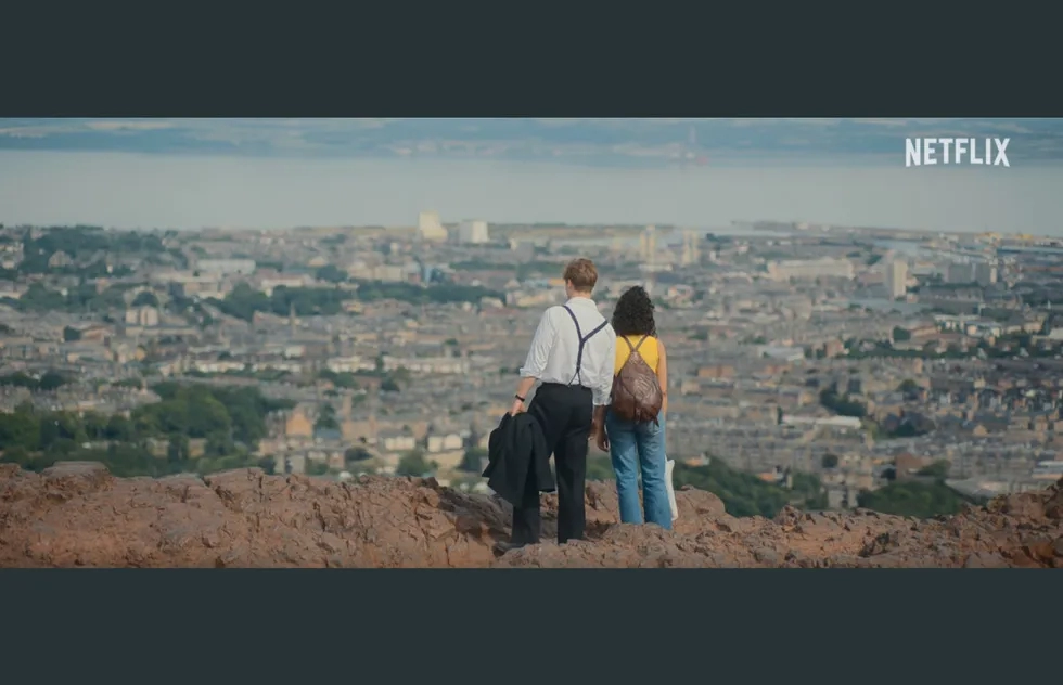 Screenshot from 'One Day' featuring Arthur's Seat in Edinburgh, Scotland