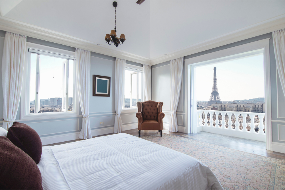 A hotel room in Paris with an Eiffel Tower view