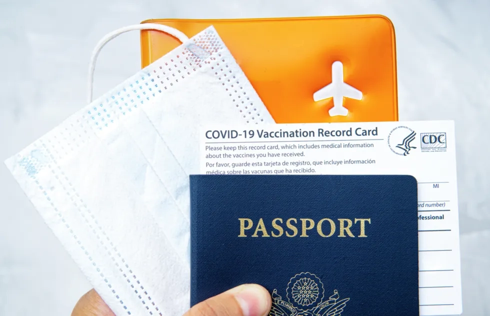 U.S. passport, vaccination card, and mask
