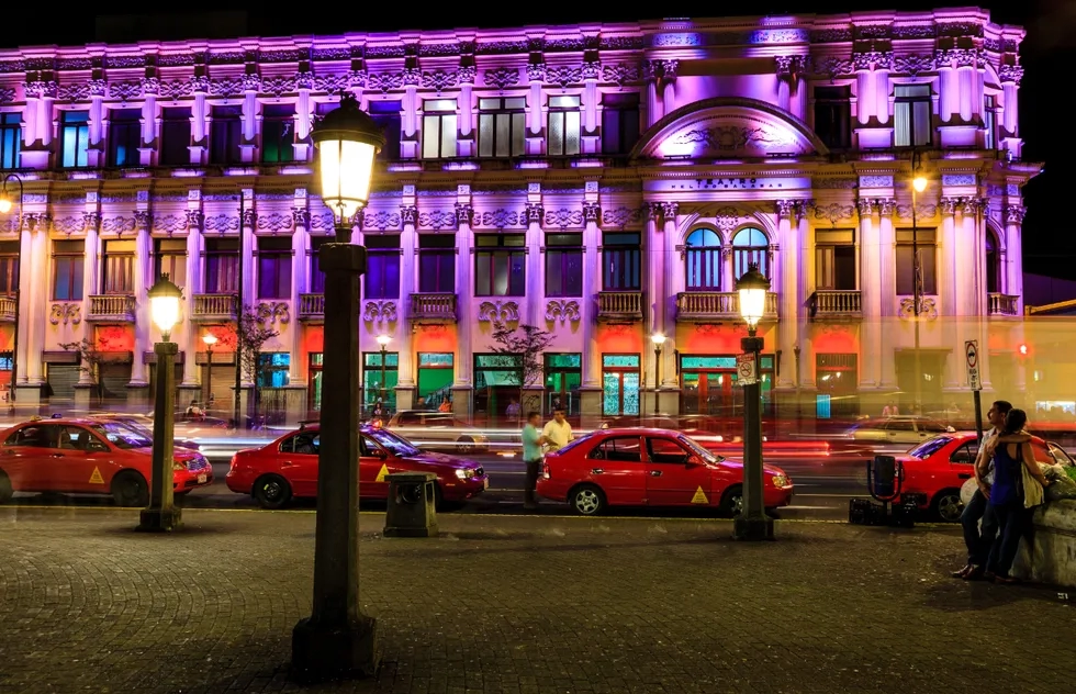Red taxis in front of the Melico Salazar Theatre in San José, Costa Rica