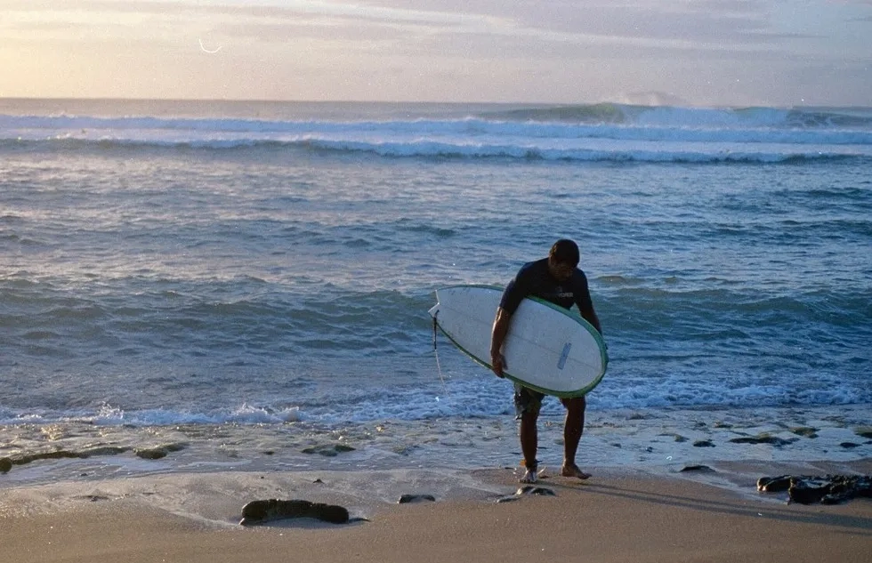 A surfer in Rincón, Puerto Rico