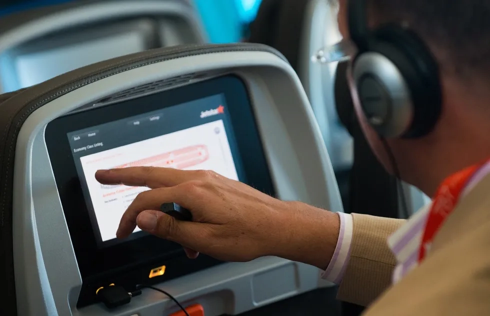 A seat-back screen on an airplane