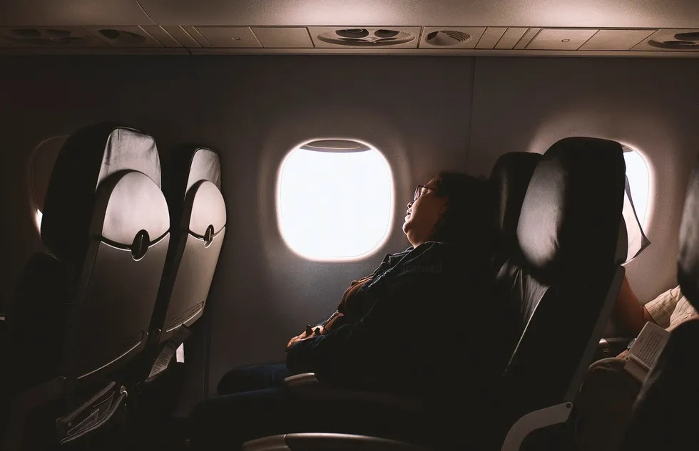 Woman sleeping on an airplane