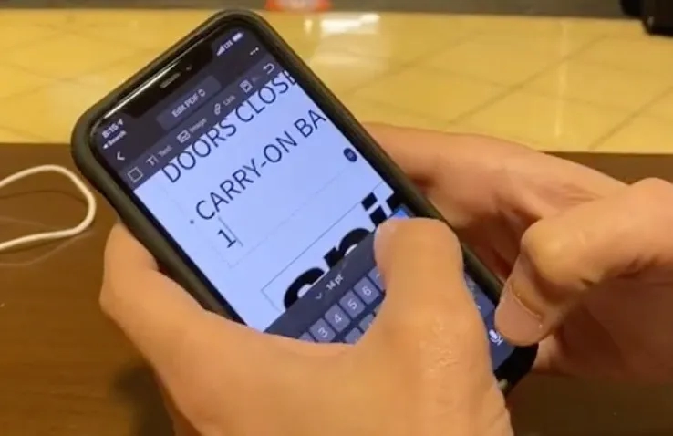 TikTok user @robkallday digitally alters a mobile ticket from Spirit Airlines to change the carry-on baggage allowance