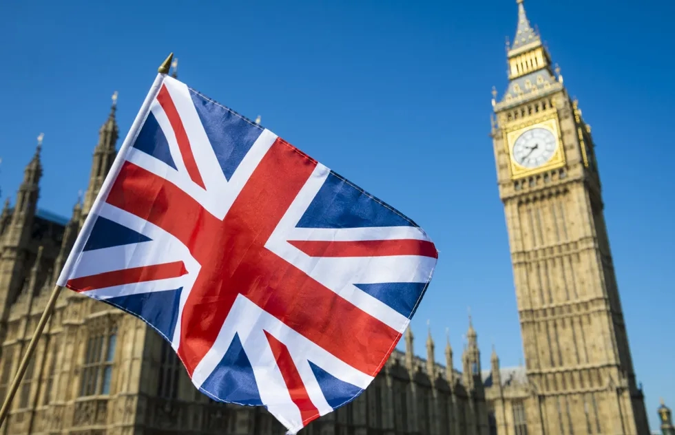 Union Jack waving in front of the Palace of Westminster in London