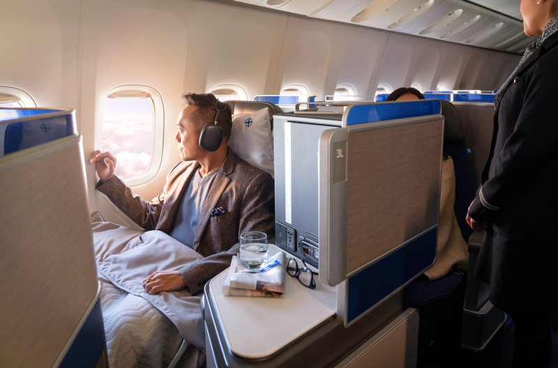 Man sits in United Polaris® seat