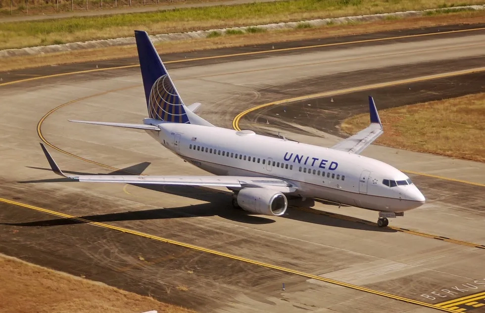 A United Airlines plane sits on an airport tarmac