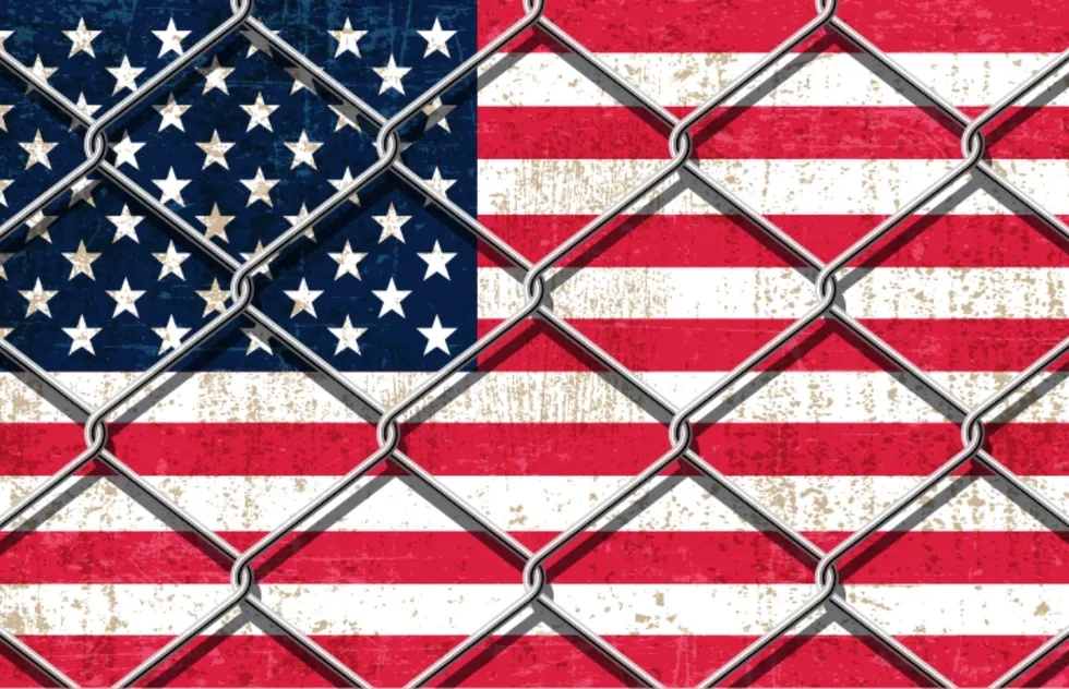 American flag behind chain link fence (illustration)