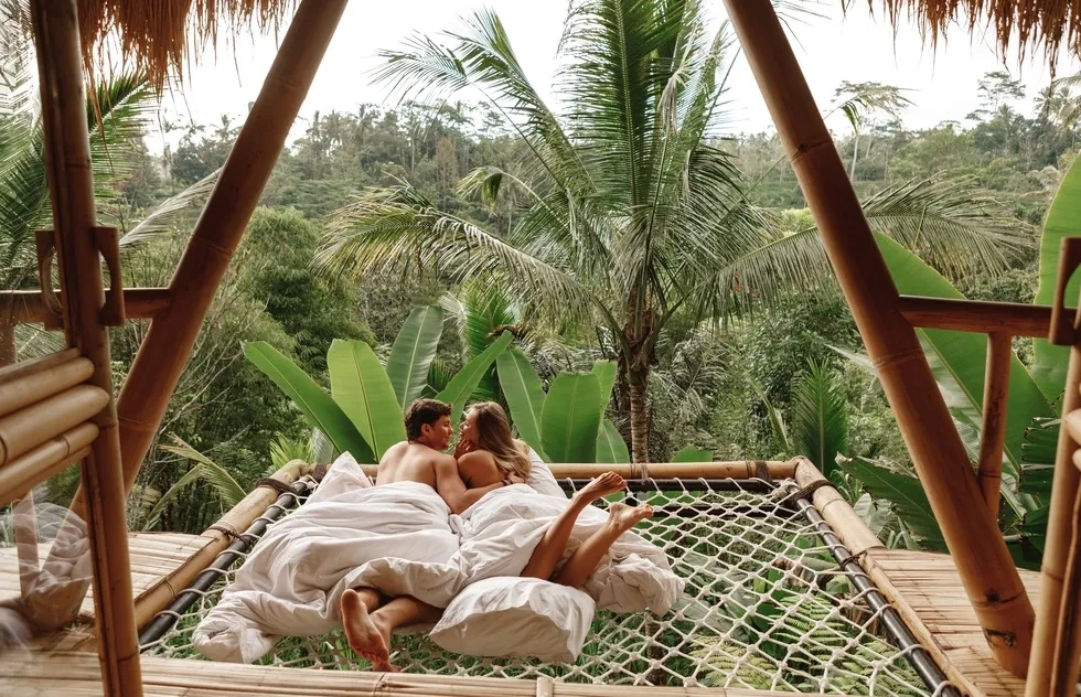 couple in sheets in bed on Bali