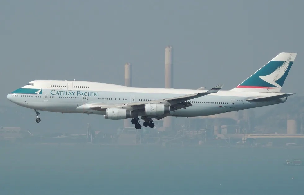 Cathay Pacific plane landing in smoggy Hong Kong