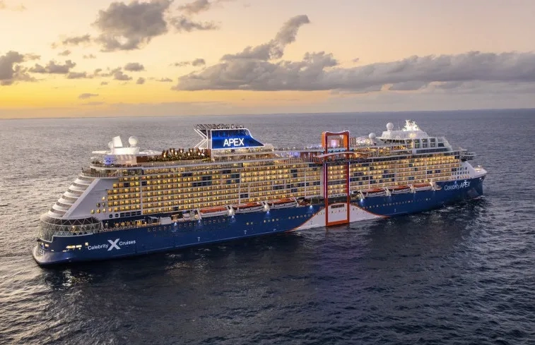 Celebrity Apex sailing at dusk