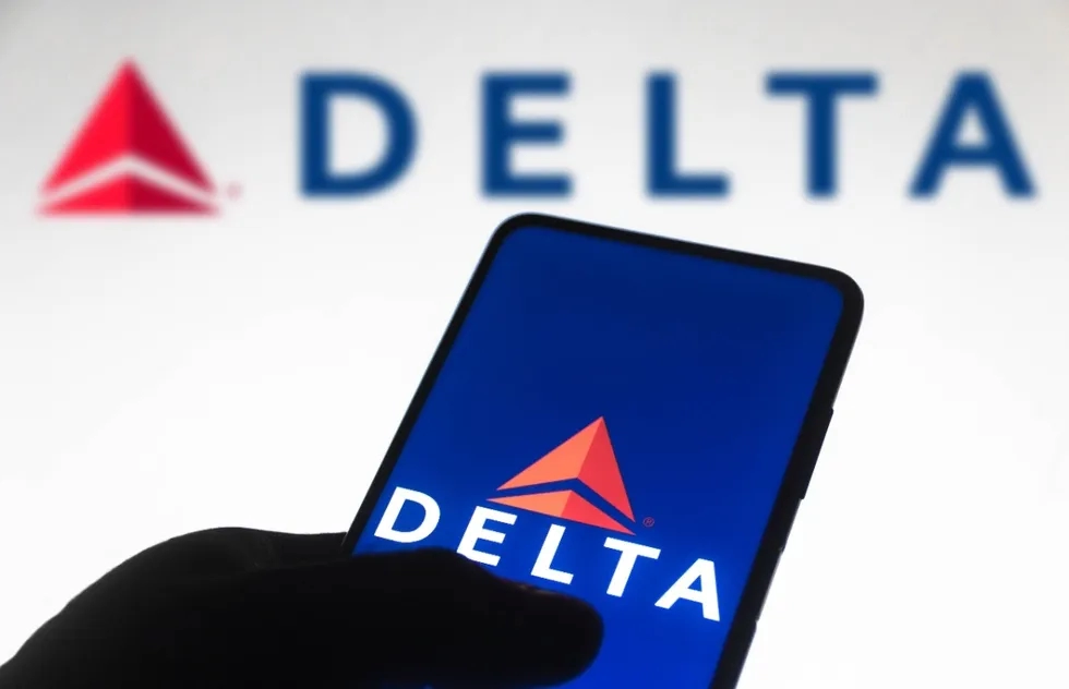 Delta Air Lines mobile screen in front of Delta logo