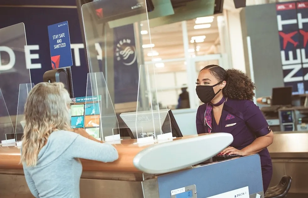 Masked customer service agent, Delta Air Lines