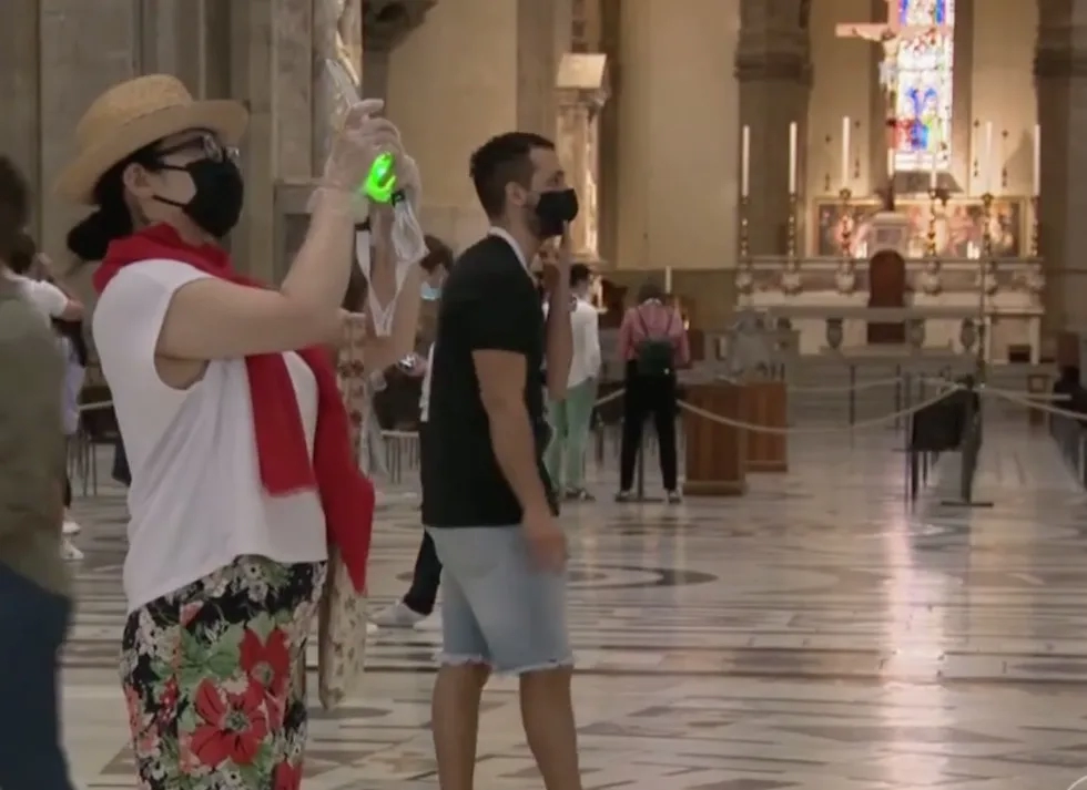 Tourists in Florence Cathedral with social distancing measures and masks