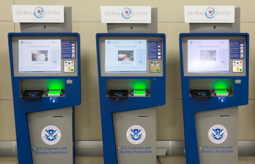 three Global Entry kiosks