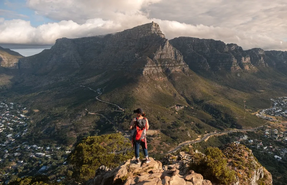 hiker in front of Table Mountain, Cape Town, South Africa