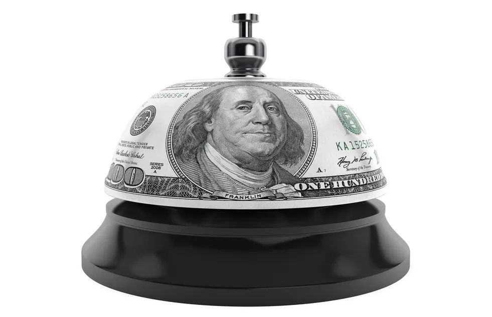 hotel desk bell made of $100 bill