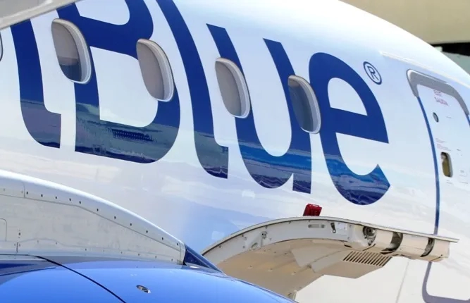 JetBlue plane, extreme close-up with open baggage hatch