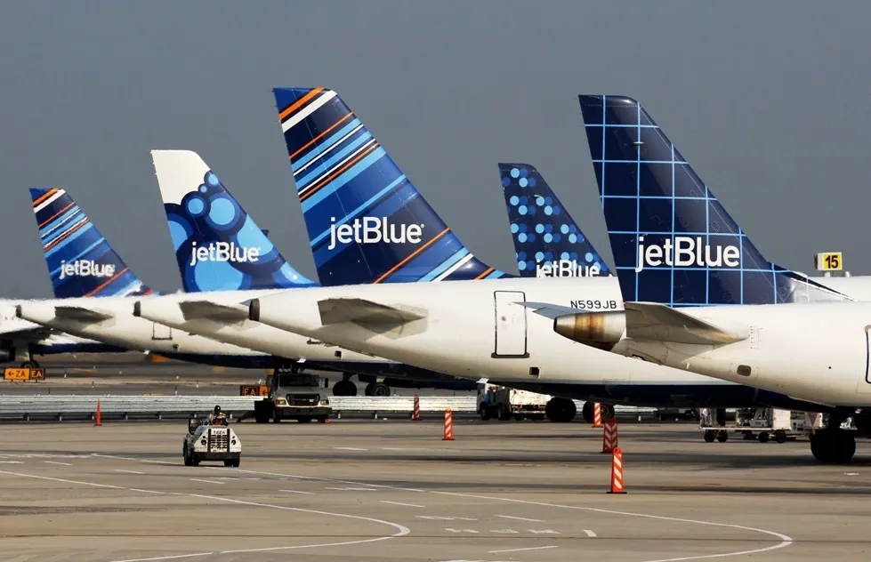 JetBlue tail fins lined up at terminal