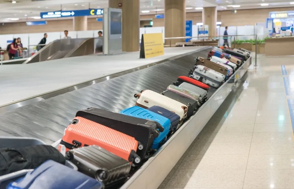unattended luggage on airport baggage carousel