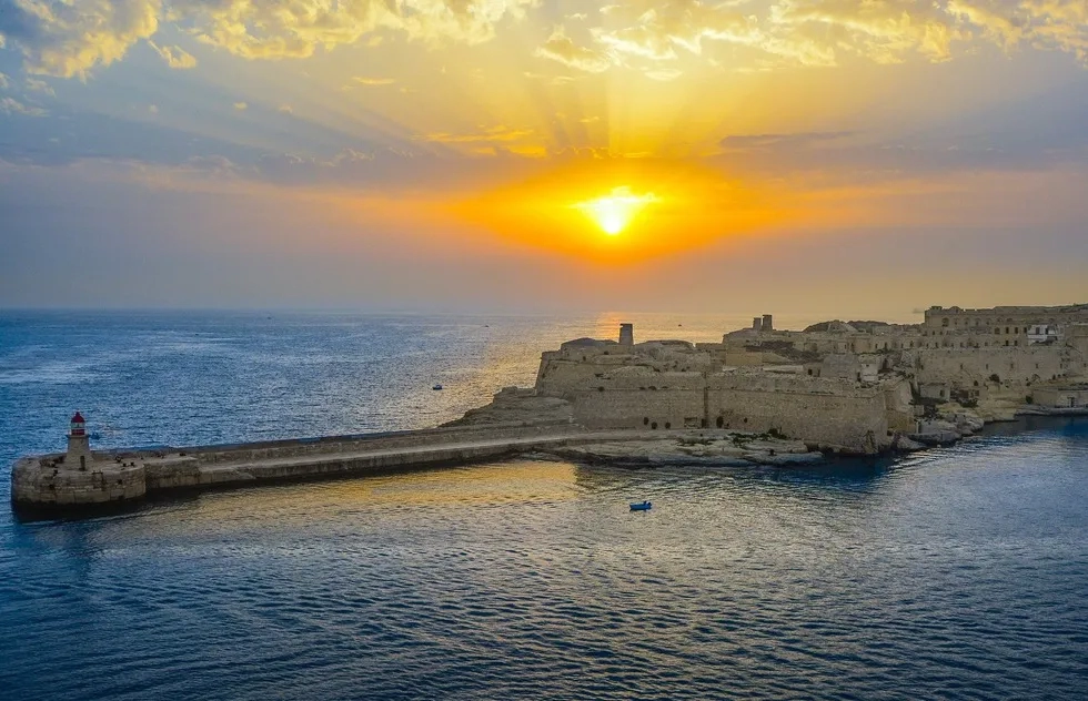 sunrise over wharf in old Malta
