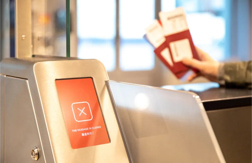 electronic passport kiosk displaying no entry notice