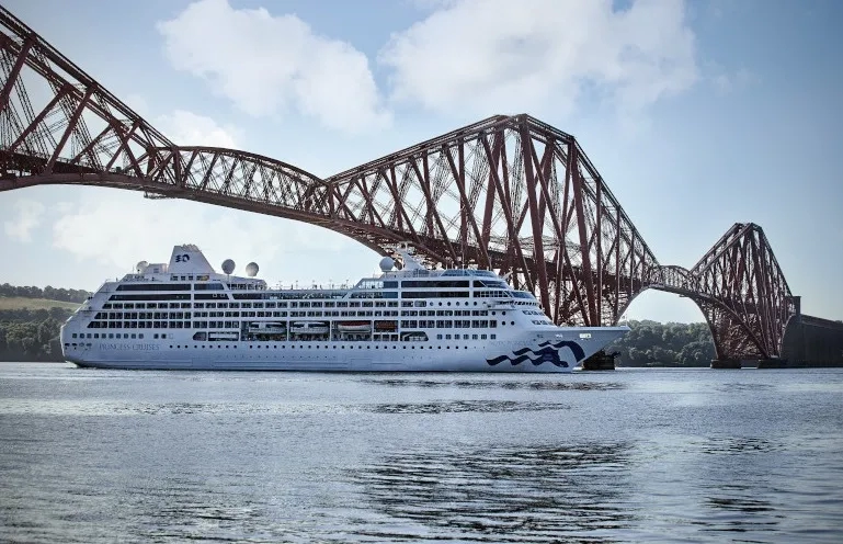 Pacific Princess (2002-2021) sails under bridge