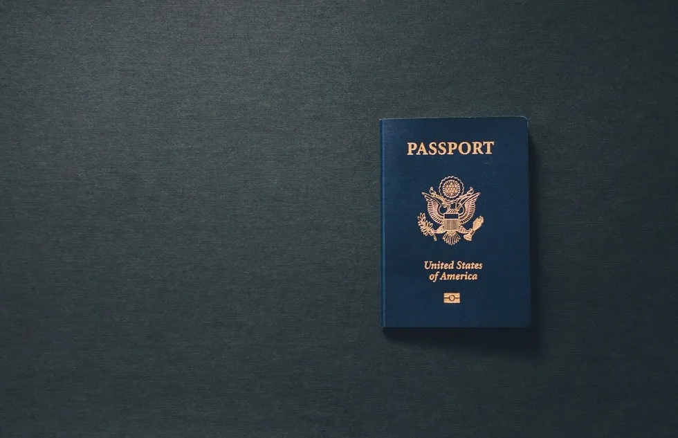 United States Passport on plain grey background