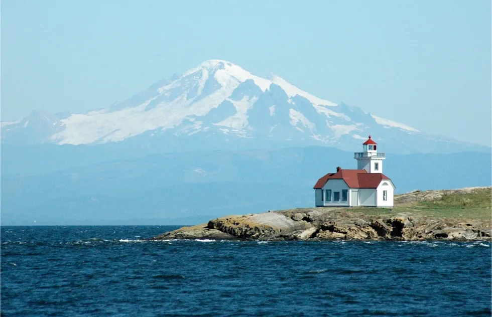 Patos Island lighthouse with Mt Baker in distance, San Juan Islands, Washington