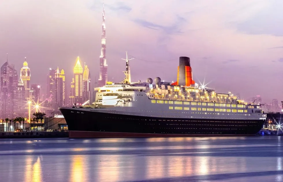 QE2 (Queen Elizabeth 2) docked in Dubai at evening