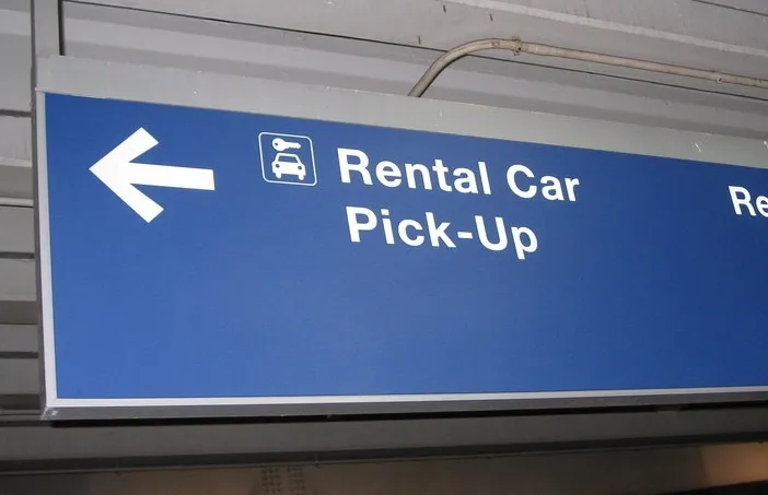 Rental car overhead airport sign