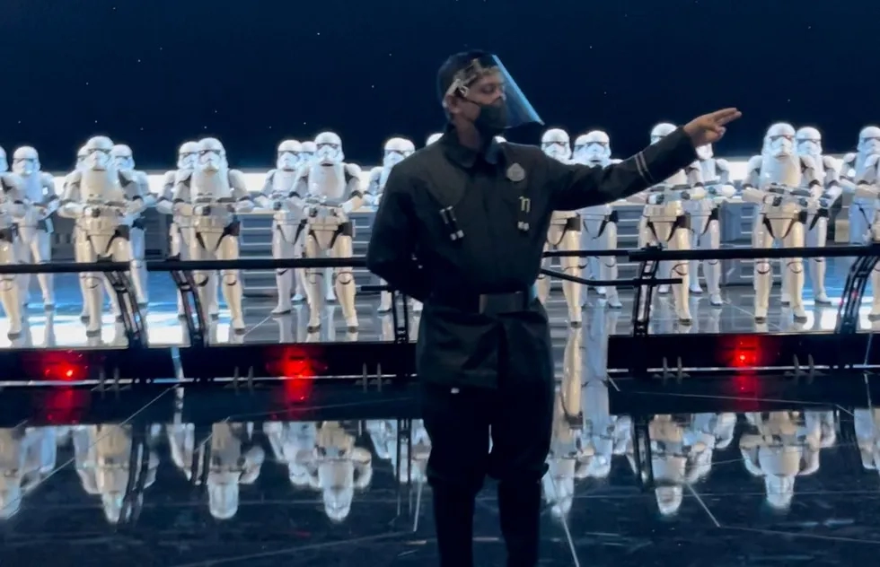 Disneyland worker wearing face shield with Stormtroopers on Rise of the Resistance, Disneyland