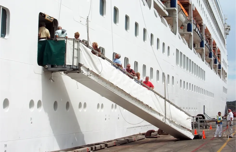 cruise ship gangway with people on it
