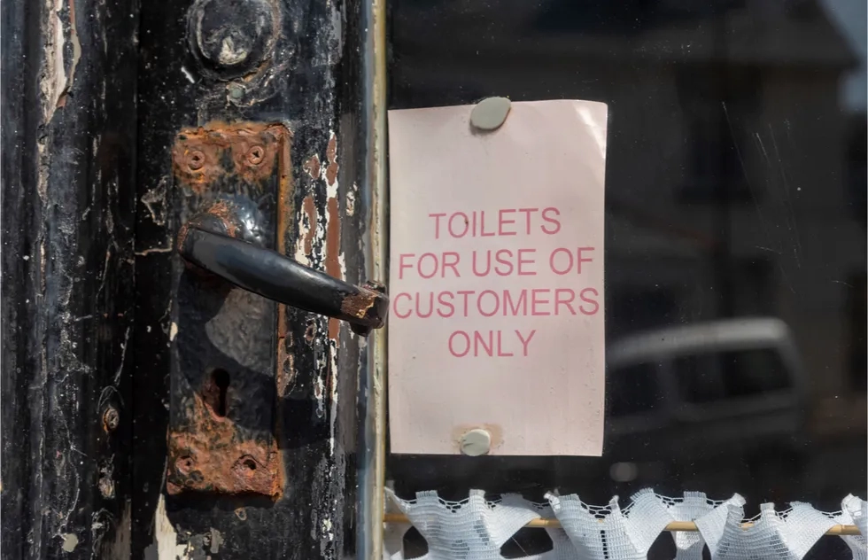 toilet for customers only sign in door