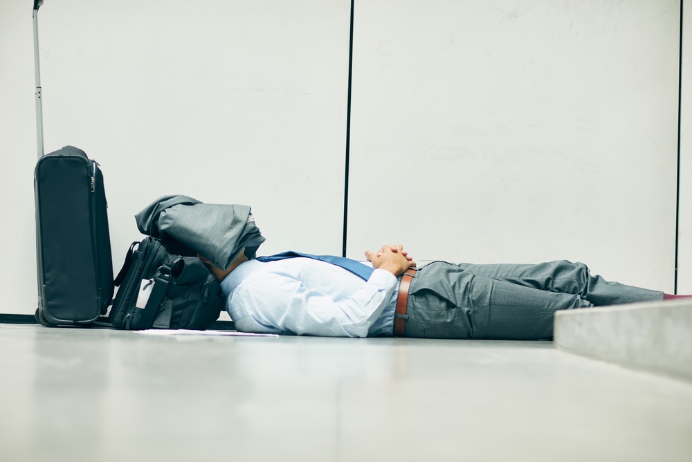 Man Asleep In Airport