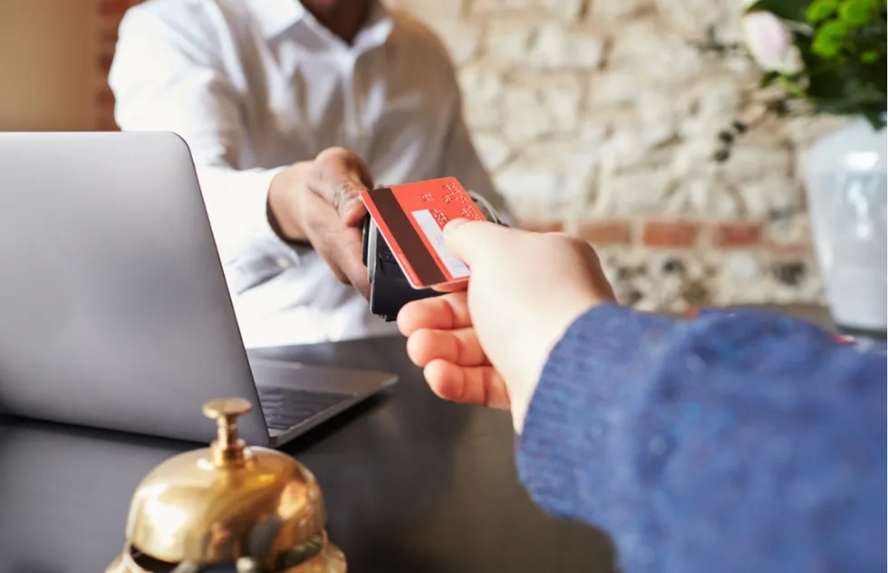 Making a credit card payment at a hotel