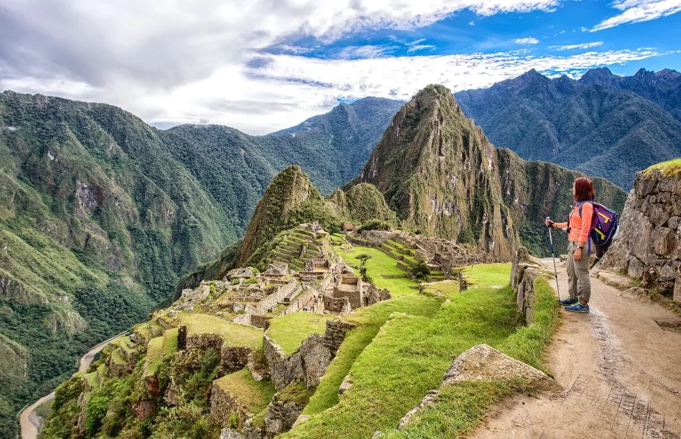 solo hiker above Machu Picchu on a clear, empty day