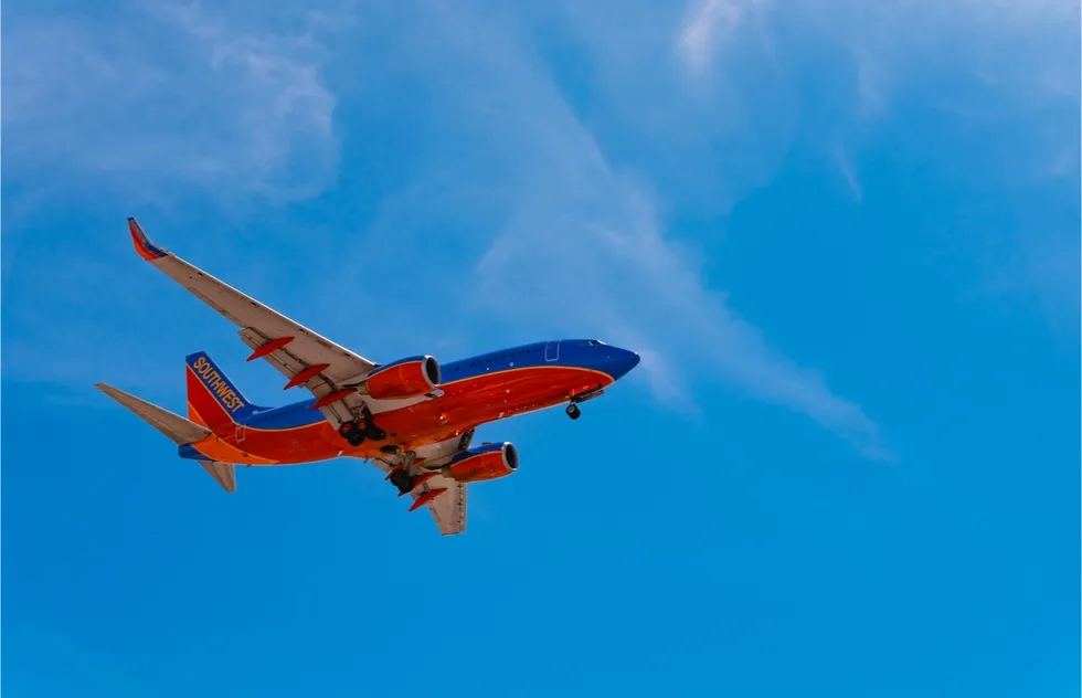 Southwest Airlines plane flying, seen from below